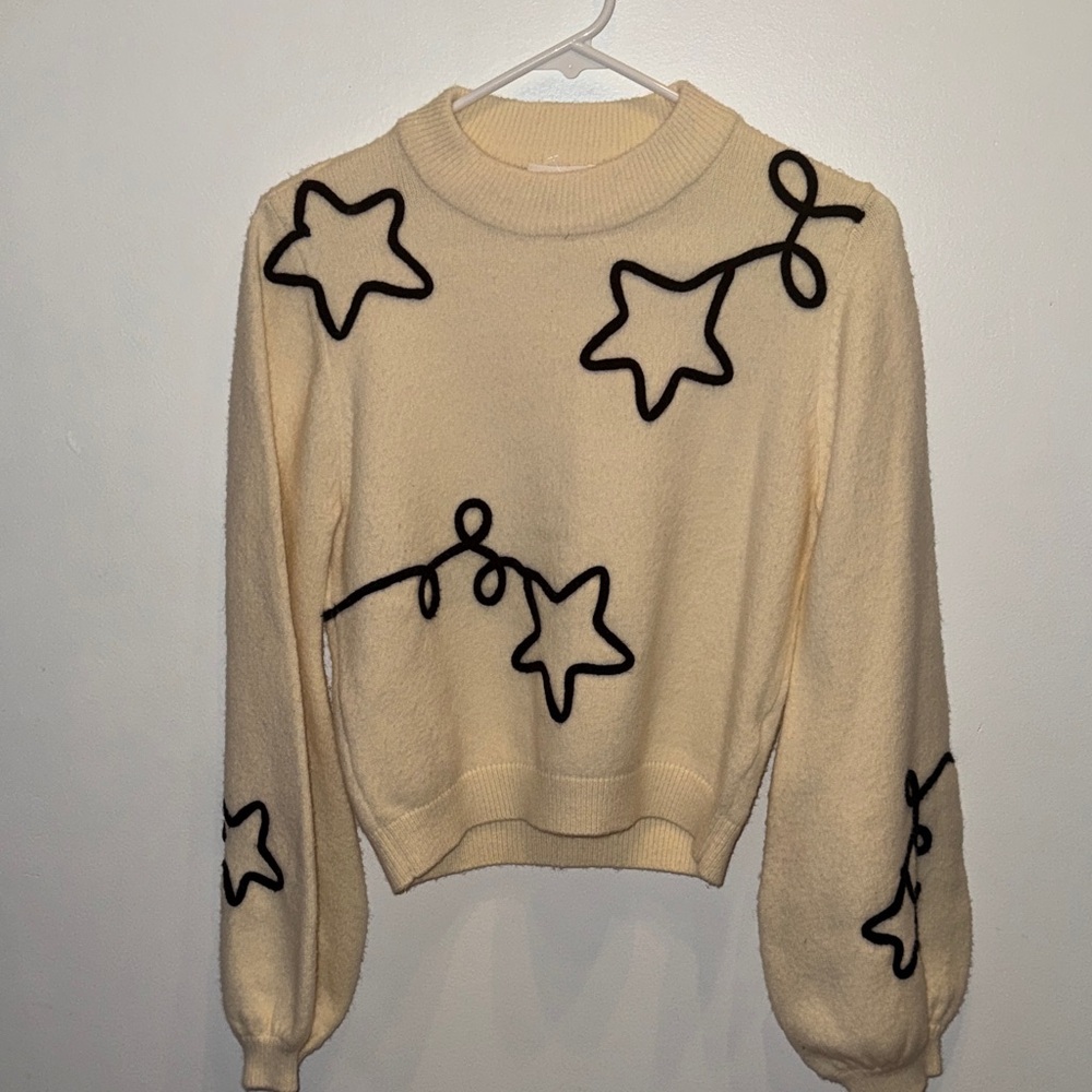 Storia Cream Sweater with Black Star Design
